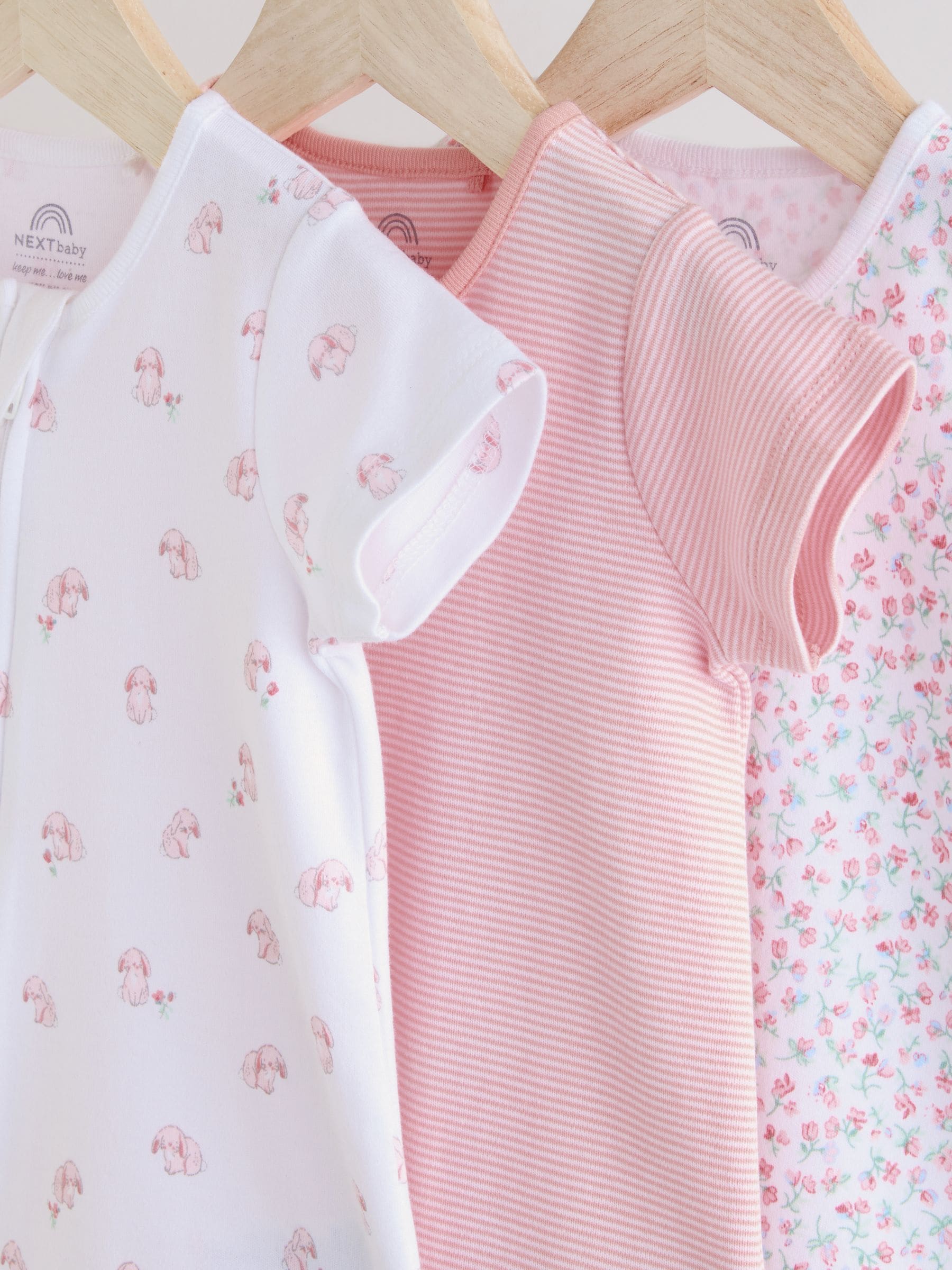 Buy Pink 3 Pack Two Way Zip Baby Rompers (0mths-3yrs) from Next
