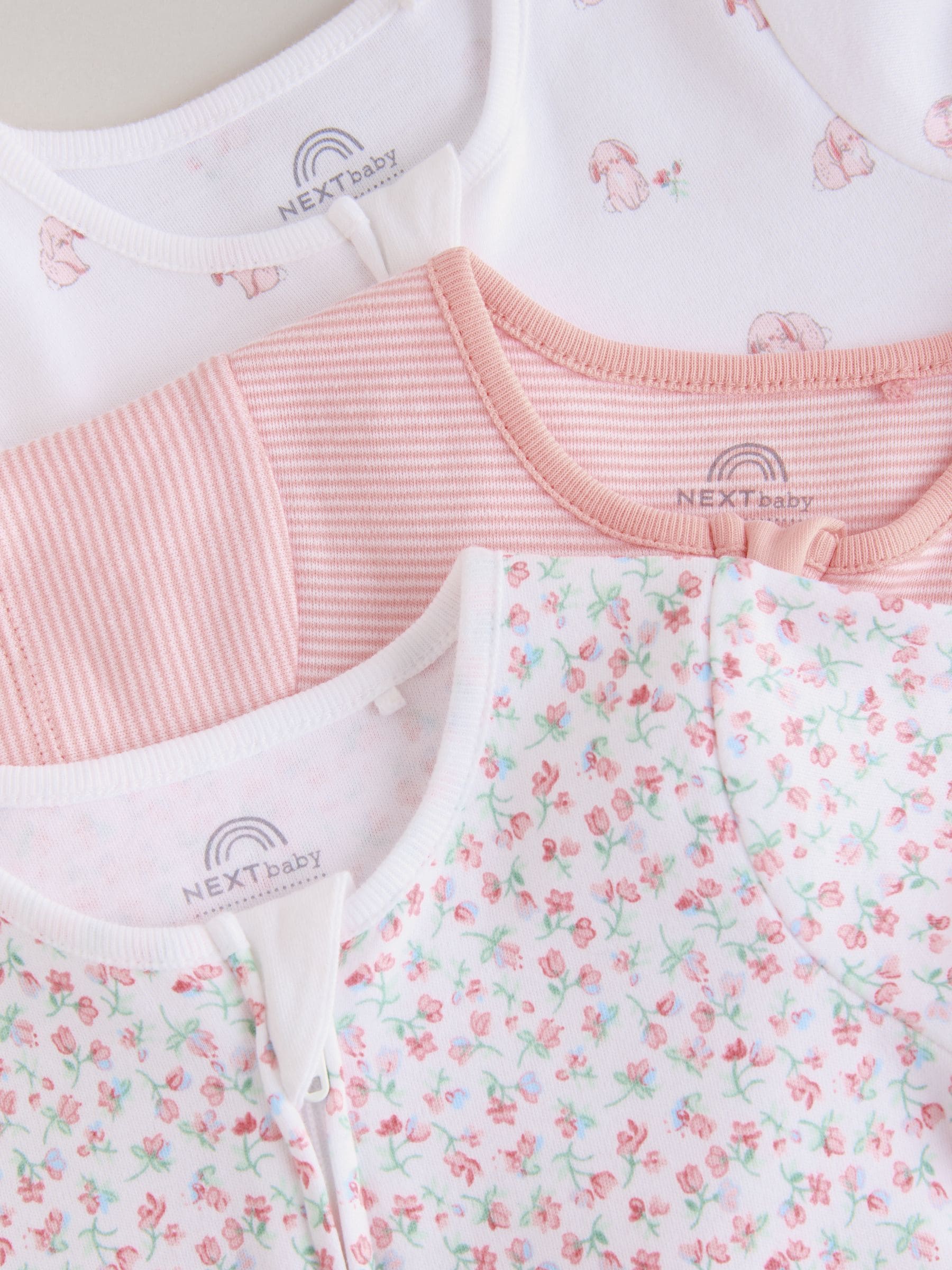 Buy Pink 3 Pack Two Way Zip Baby Rompers (0mths-3yrs) from Next