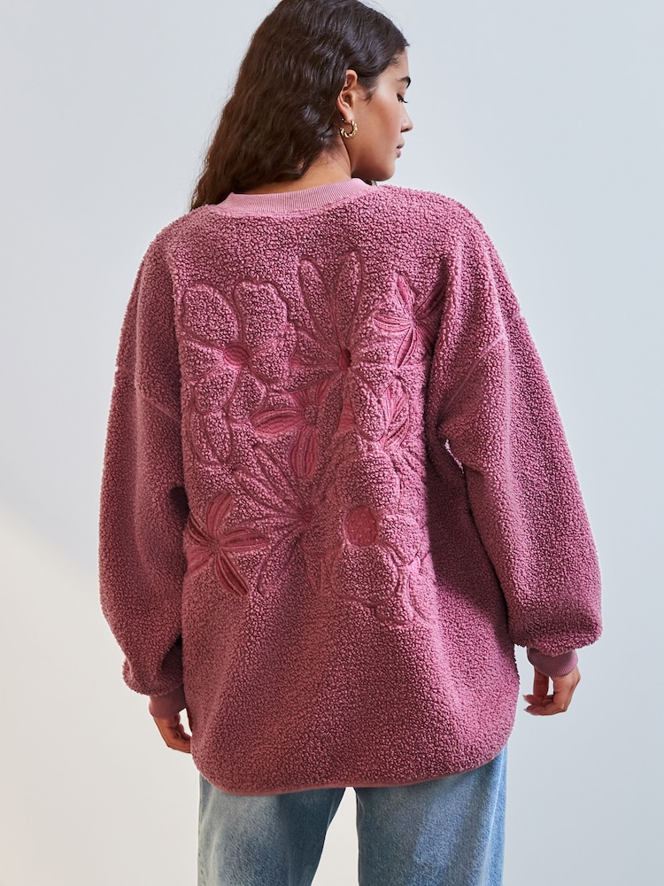 Blush Pink Floral Graphic Print Relaxed Fit Teddy Borg Fleece Cord Back Longline Crew Neck Sweatshirt - Image 1 of 8