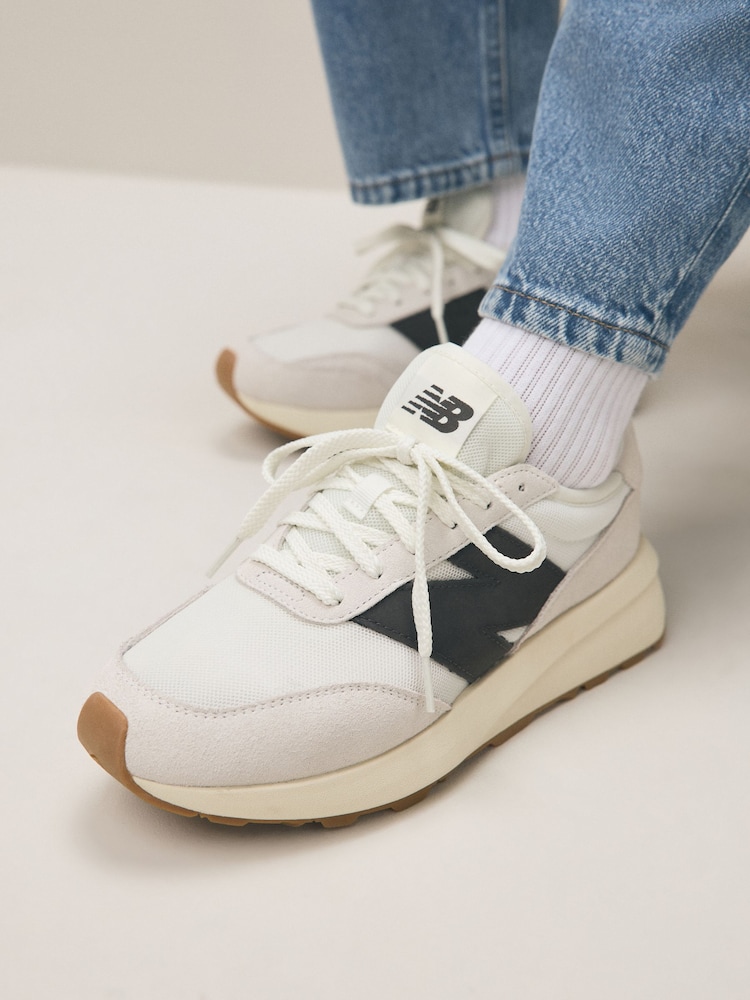 New Balance White/Black Womens 370 Trainers - Image 1 of 15 New Balance White/Black Womens 370 Trainers - Image 1 of 15