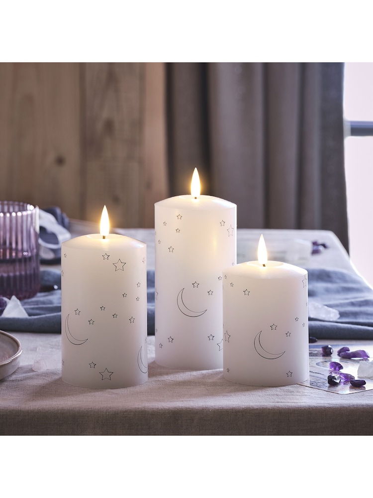 Lights4fun White Truglow LED Pillar Candles with Moon Star Design Set of 3 - Image 2 of 2 Lights4fun White Truglow LED Pillar Candles with Moon Star Design Set of 3 - Image 2 of 2