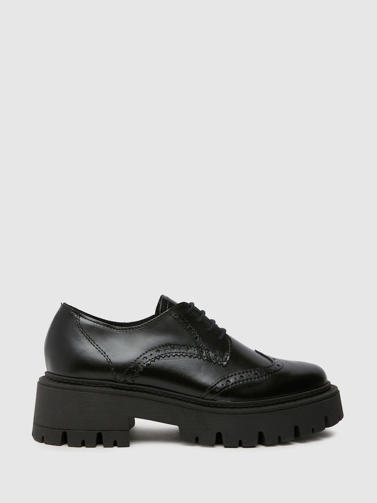 Schuh Liora Chunky Leather črna gležnjar z luknjičastim vzorcem in vezalkami - Slika 1 iz 4
