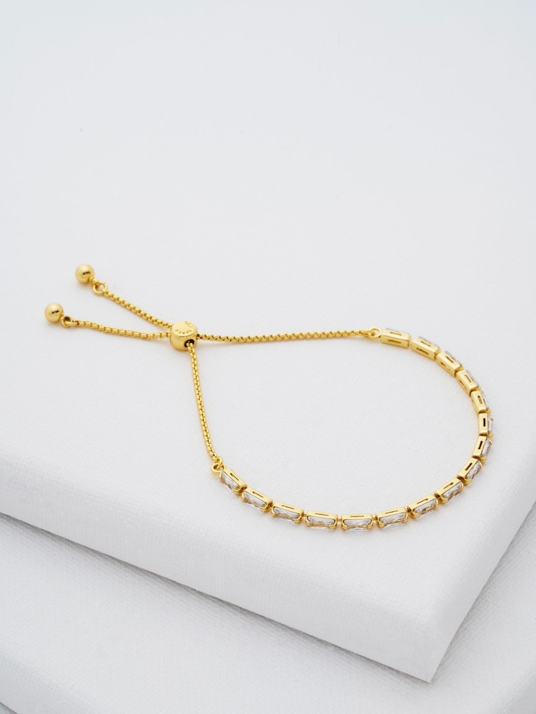 Ted Baker Gold Tone Isela Crystal Baguette Slinky Adjustable Bracelet - Image 1 of 7