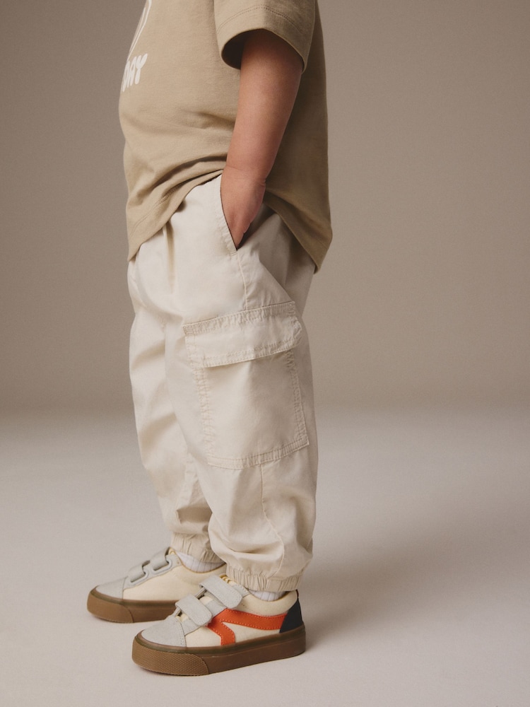 Neutral 100% Cotton Baggy Cargo Trousers with Toggle Waist (3mths-7yrs) - Image 1 of 7 Neutral 100% Cotton Baggy Cargo Trousers with Toggle Waist (3mths-7yrs) - Image 1 of 7