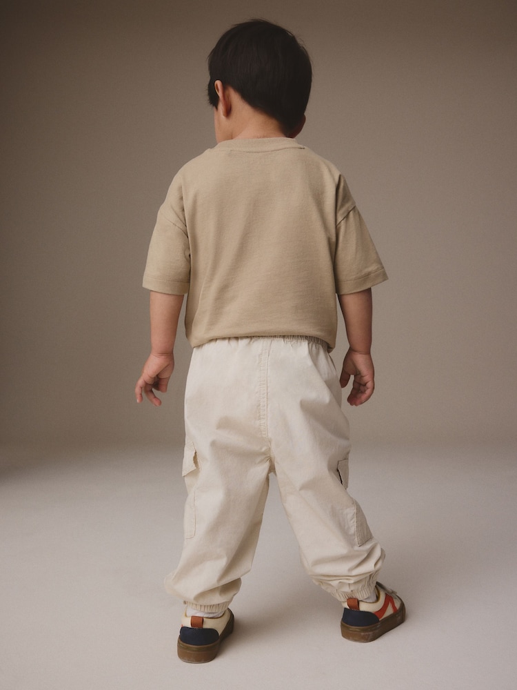 Neutral 100% Cotton Baggy Cargo Trousers with Toggle Waist (3mths-7yrs) - Image 2 of 7 Neutral 100% Cotton Baggy Cargo Trousers with Toggle Waist (3mths-7yrs) - Image 2 of 7