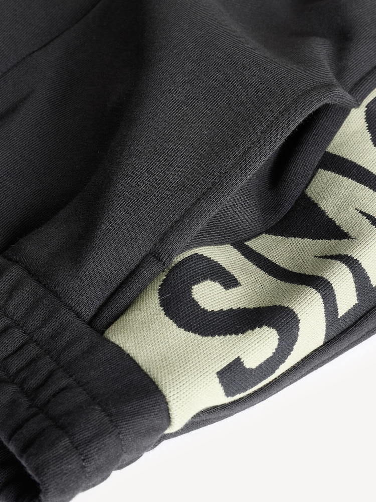 Stella McCartney Kids Logo Cuffed Black Joggers - Image 4 of 4 Stella McCartney Kids Logo Cuffed Black Joggers - Image 4 of 4