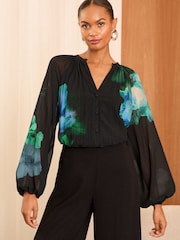 Love & Roses Black Floral Printed Pleated V Neck Blouse - Image 1 of 4