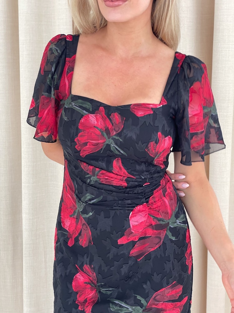 Negro y rojo floral - Vestido a media pierna fruncido Heidi de Girl In Mind - Imagen 4 de 4 Negro y rojo floral - Vestido a media pierna fruncido Heidi de Girl In Mind - Imagen 4 de 4