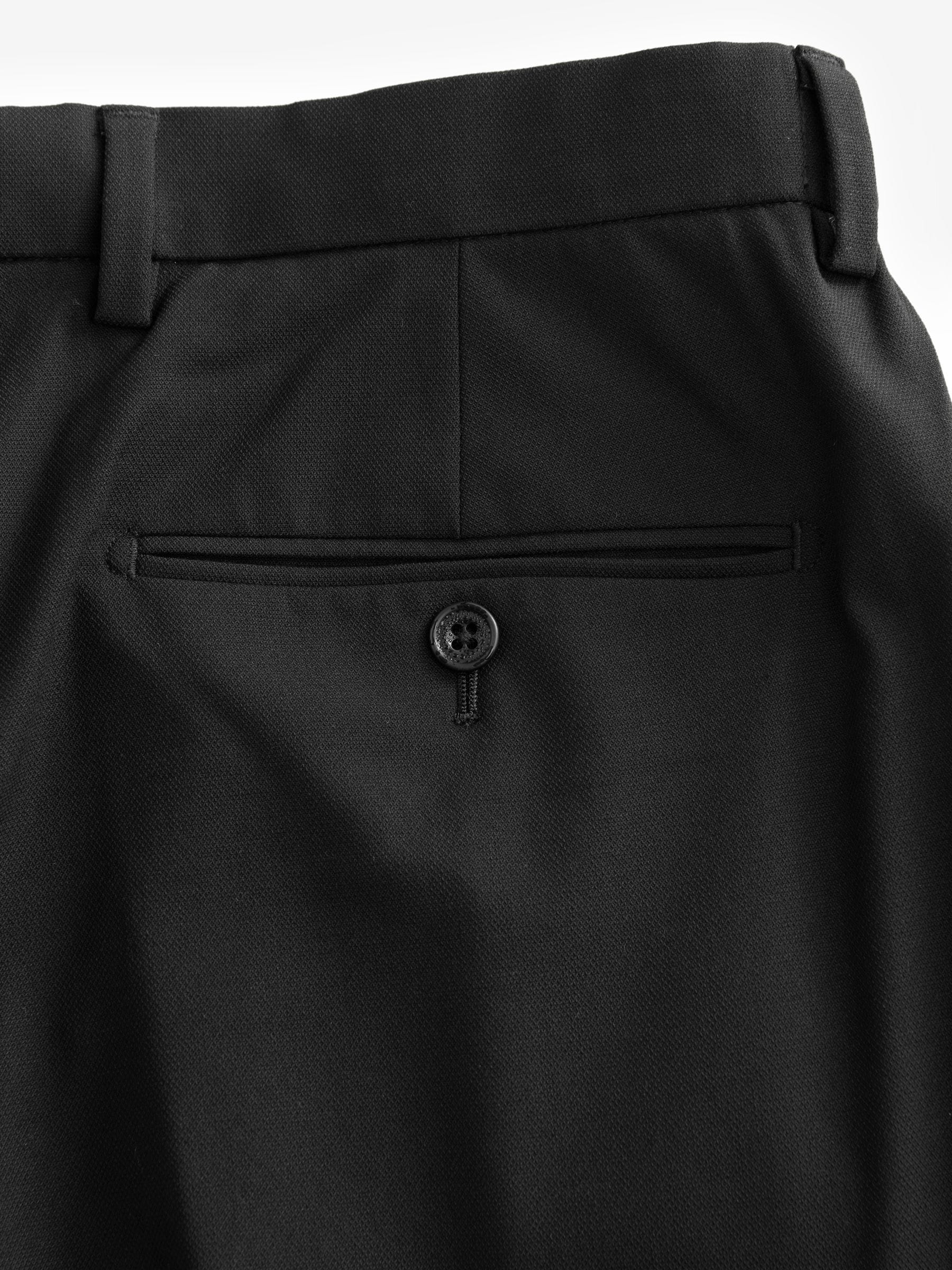Buy Black Muscle Fit Motionflex Stretch Suit Trousers from Next USA