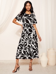 Friends Like These Mono Geo Petite ITY Flutter Short Sleeve Midi Dress - Image 1 of 4