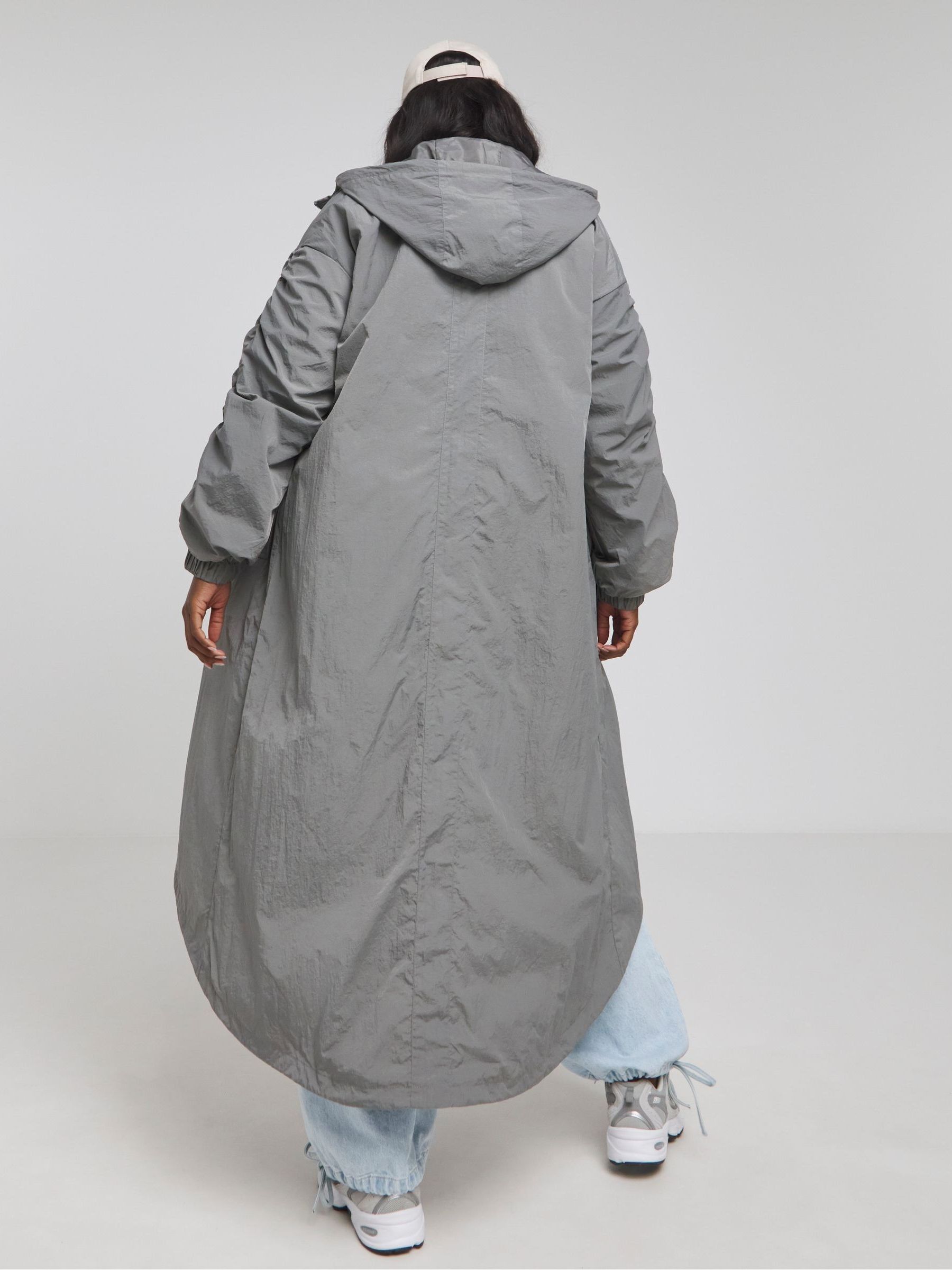 Buy Simply Be Grey Dipped Hem Rain Coat from Next Saudi Arabia