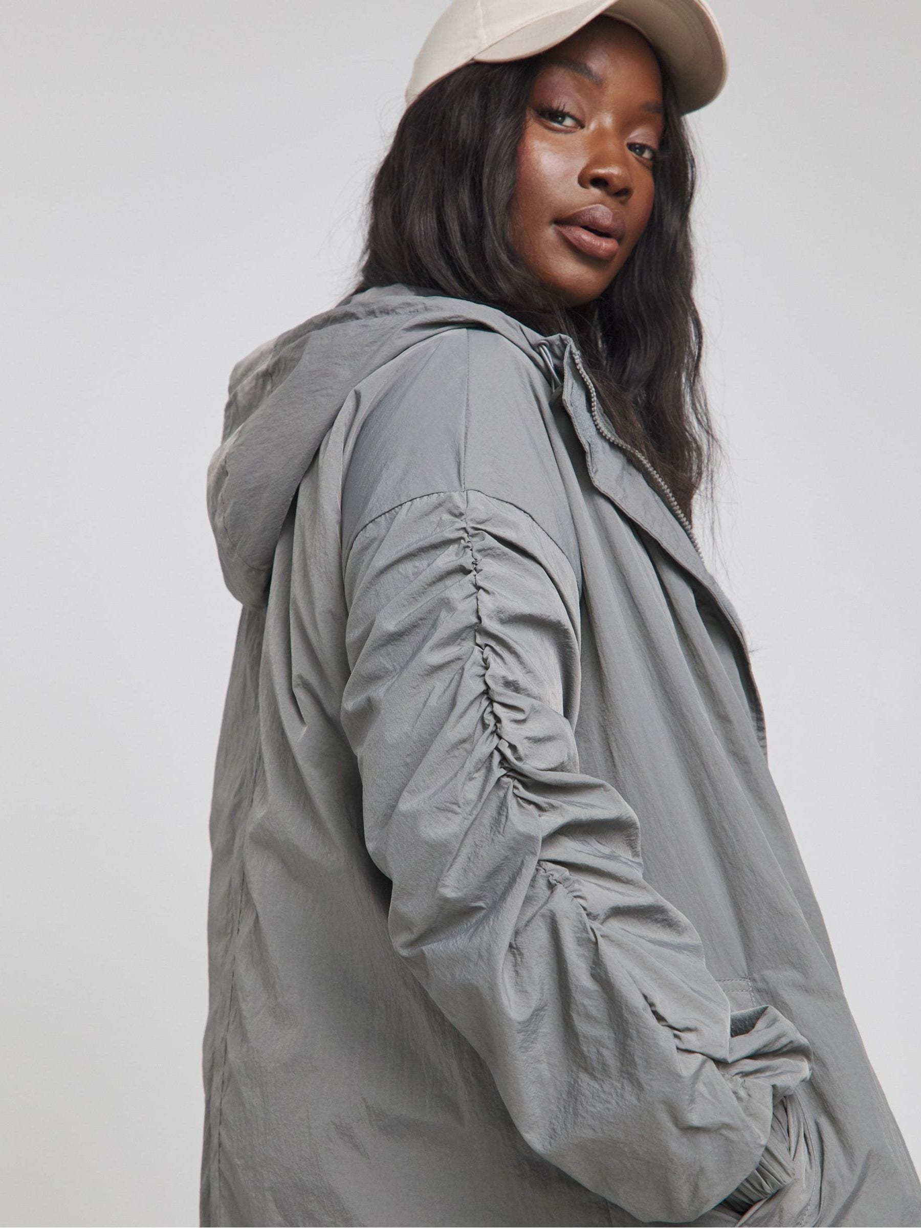Buy Simply Be Grey Dipped Hem Rain Coat from Next Saudi Arabia