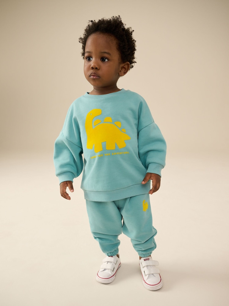 Grün/Gelb, Dino - Set mit Jersey-Sweatshirt und Jogginghose (3 Monate bis 7 Jahre) - Bild 1 von 4 Grün/Gelb, Dino - Set mit Jersey-Sweatshirt und Jogginghose (3 Monate bis 7 Jahre) - Bild 1 von 4