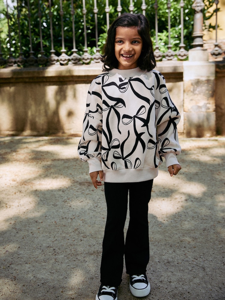 Cream Bow/Black Sweatshirt and Ribbed Flare Set (3-16yrs) - Image 1 of 2