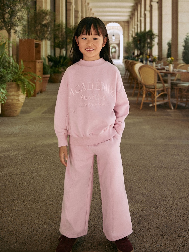 Pink Slogan Sweatshirt And Wide Leg Joggers Set (3-16yrs) - Image 1 of 11 Pink Slogan Sweatshirt And Wide Leg Joggers Set (3-16yrs) - Image 1 of 11