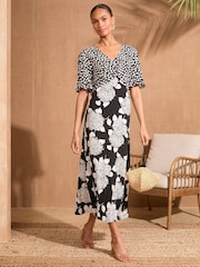 Love & Roses Black/White Floral Print Patched Twist Detail Midi Dress - Image 1 of 4