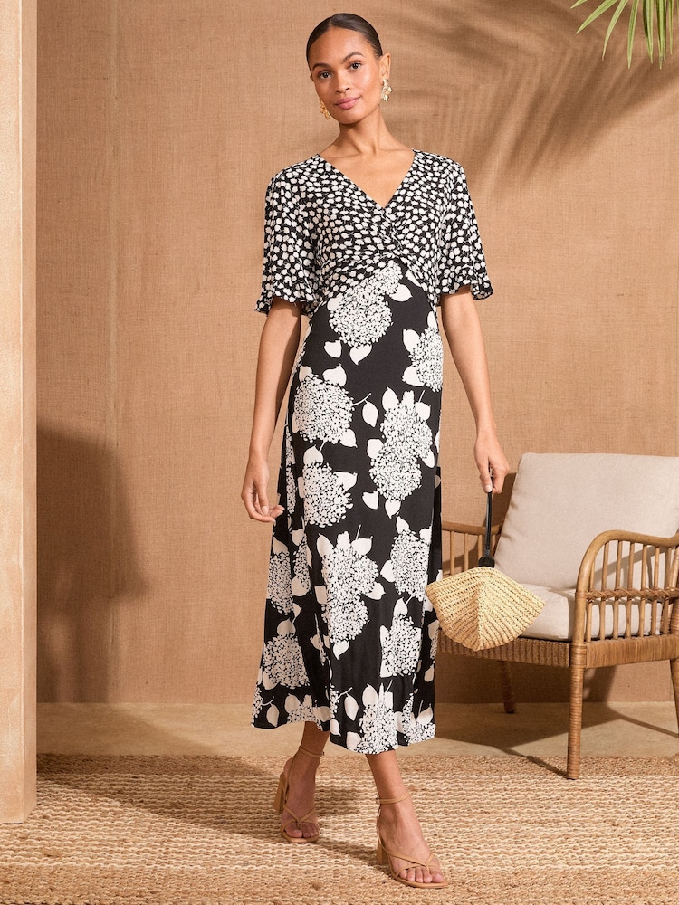 Love & Roses Black/White Floral Print Patched Twist Detail Midi Dress - Image 1 of 4 Love & Roses Black/White Floral Print Patched Twist Detail Midi Dress - Image 1 of 4