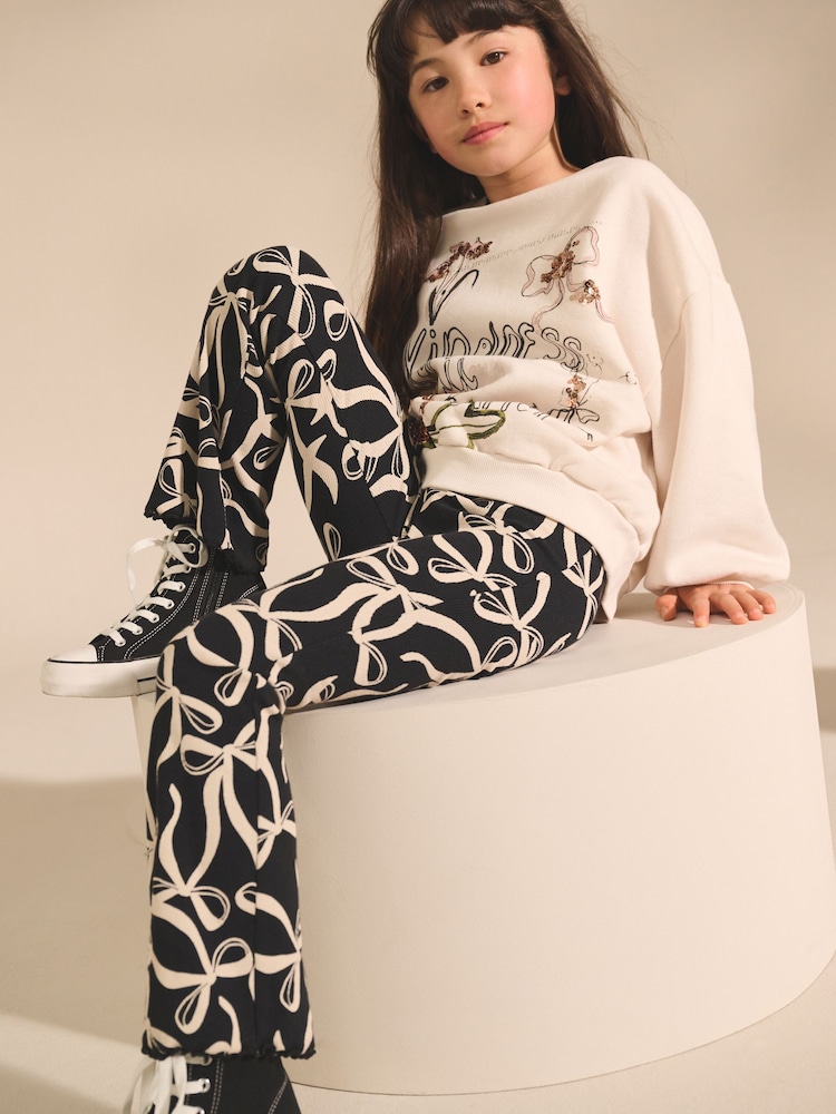 Black/White Bow 1 Pack Rib Flare Leggings (3-16yrs) - Image 1 of 1 Black/White Bow 1 Pack Rib Flare Leggings (3-16yrs) - Image 1 of 1