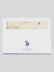 من U.S. Polo Assn. حزمة من وشاح وقبعة شتوية محبوكة بنمط مجدول للنساء Signature - صورة 1 من 4