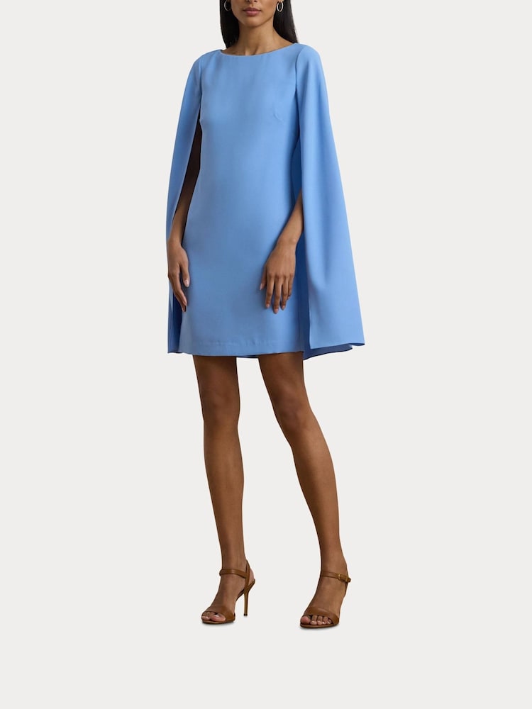 cape georgette cocktail dress LAUREN Ralph Lauren SKU: 9737266 Dramatic detachable cape creates a sophisticated silhouette with effortless movement Elegant round neckline complemented by sparkling diamante broach details at the shoulders Flowing georgette fabric offers a graceful drape that flatters the figure Mid Karen Millen Archive Collection -