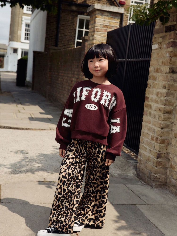 Burgundy Red Varsity Sweatshirt And Animal Print Wide Leg Trousers Set (3-16yrs) - Image 1 of 9
