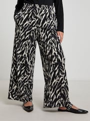 Simply Be Black Zebra Print Wide Leg Pleat Front Trousers - Image 1 of 4