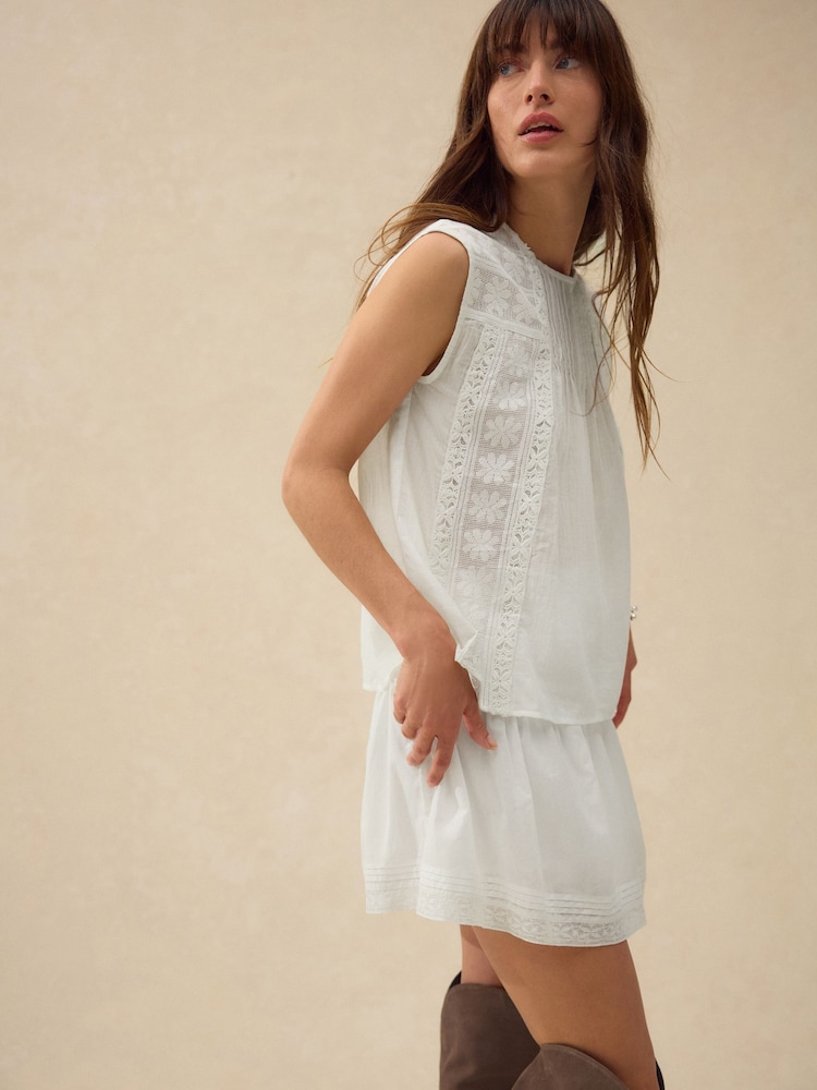White Sleeveless Pintuck Blouse With Mesh Embroidery - Image 1 of 8