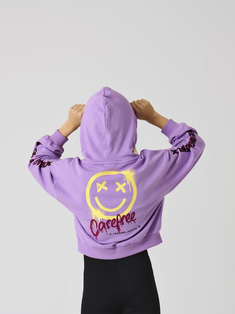 Sudadera morada de algodón 100 % con capucha y estampado en la parte trasera con eslogan "Carefree" de ONLY KIDS - Imagen 1 de 4