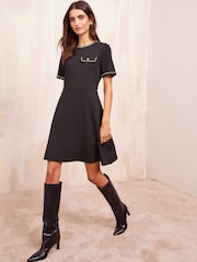 Friends Like These Black Petite Short Sleeve Ponte Shift Mini Dress With Gold Chain Detailing - Image 1 of 4