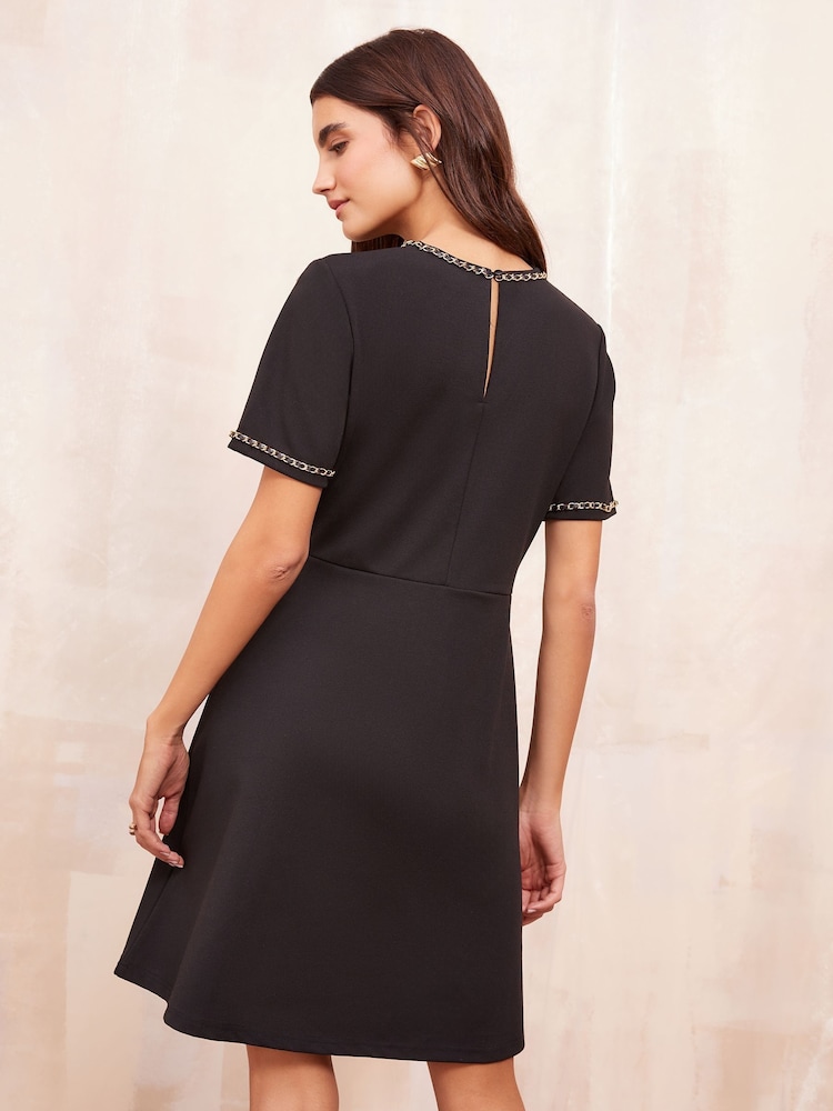 Friends Like These Black Petite Short Sleeve Ponte Shift Mini Dress With Gold Chain Detailing - Image 4 of 4