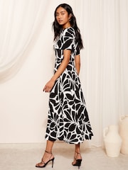 Friends Like These Black/White ITY Flutter Short Sleeve Midi Dress - Image 1 of 4