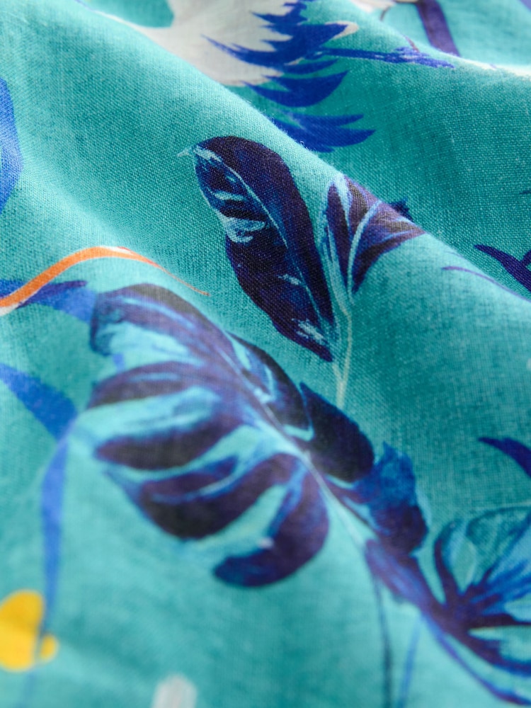 Estampado de palmeras tropicales en azul - Camisa de manga corta con lazada delantera - Imagen 8 de 8 Estampado de palmeras tropicales en azul - Camisa de manga corta con lazada delantera - Imagen 8 de 8