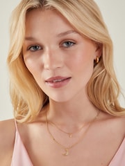 قلادة بطبقات بدلايات مستوحاة من السماء والنجوم مطلية بذهب 14 قيراط من Accessorize - Image 4 of 4