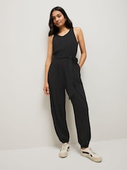 Black Sleeveless Jersey Tie Waist Jumpsuit - Image 1 of 7
