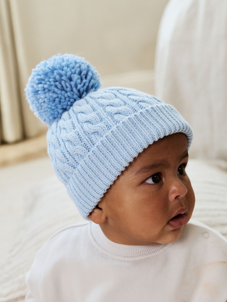 Blue Cable Baby Knitted Hat With Pom (0mths-2yrs) - Image 1 of 5 Blue Cable Baby Knitted Hat With Pom (0mths-2yrs) - Image 1 of 5