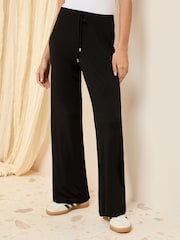 Friends Like These Black Petite Jersey Wide Leg Trousers - Image 1 of 5