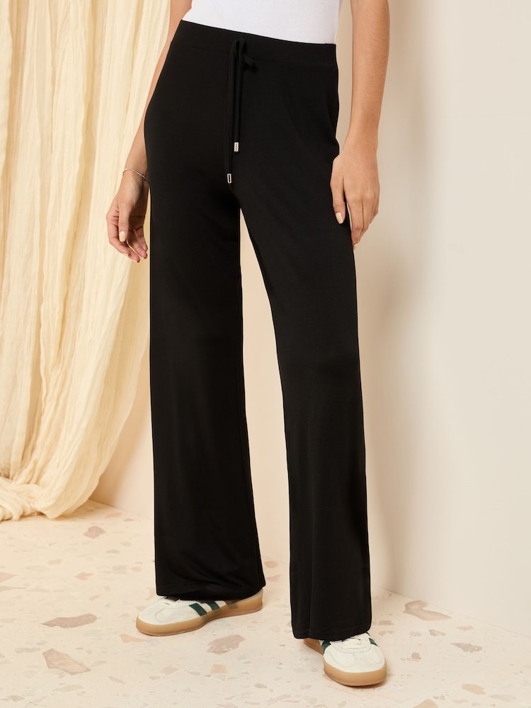 Friends Like These Black Petite Jersey Wide Leg Trousers - Image 1 of 5