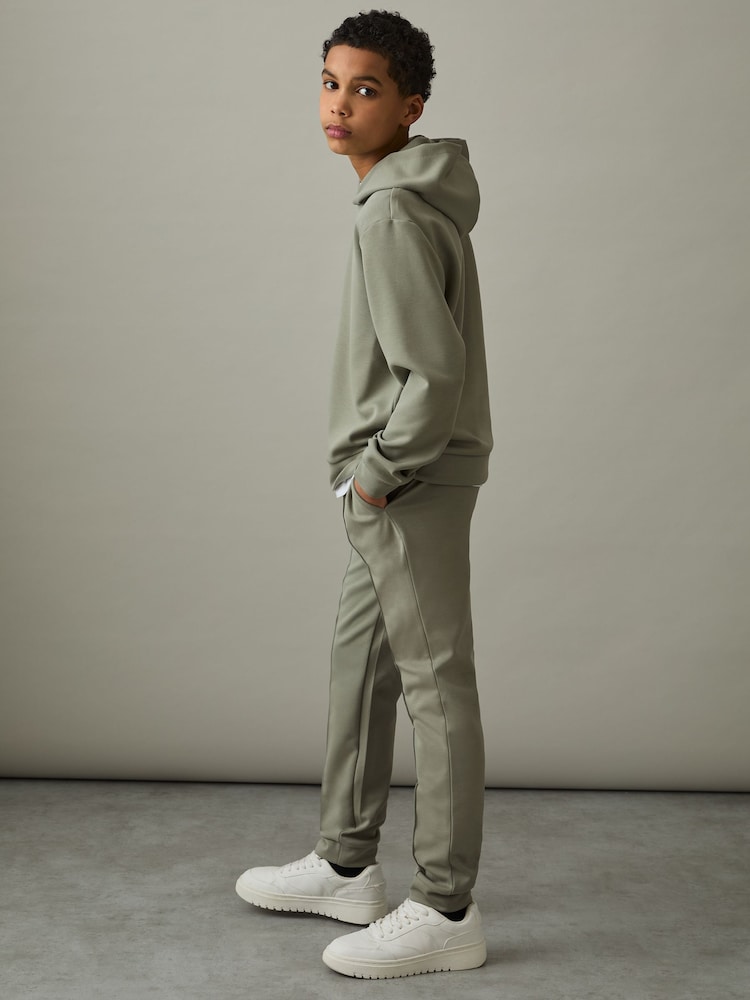 Reiss Soft Sage Green Premier 3-9 yrs Interlock Drawstring Joggers - Image 1 of 4 Reiss Soft Sage Green Premier 3-9 yrs Interlock Drawstring Joggers - Image 1 of 4