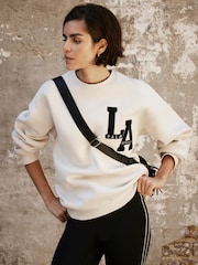 Mint Velvet Cream Cotton Blend Relaxed Glamour Logo Sweatshirt - Image 1 of 8