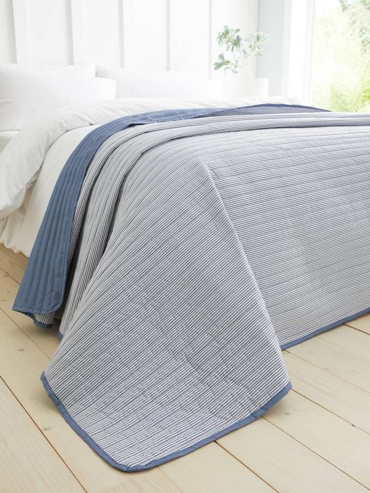 Catherine Lansfield Chambray Blue Stripe Quilted Reversible Bedspread - Image 1 of 4
