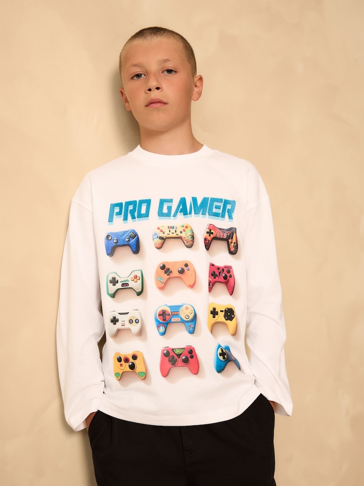 White Gamer Relaxed Fit Graphic Print Long Sleeve Cotton T-Shirt (3-16yrs) - Image 1 of 4 White Gamer Relaxed Fit Graphic Print Long Sleeve Cotton T-Shirt (3-16yrs) - Image 1 of 4