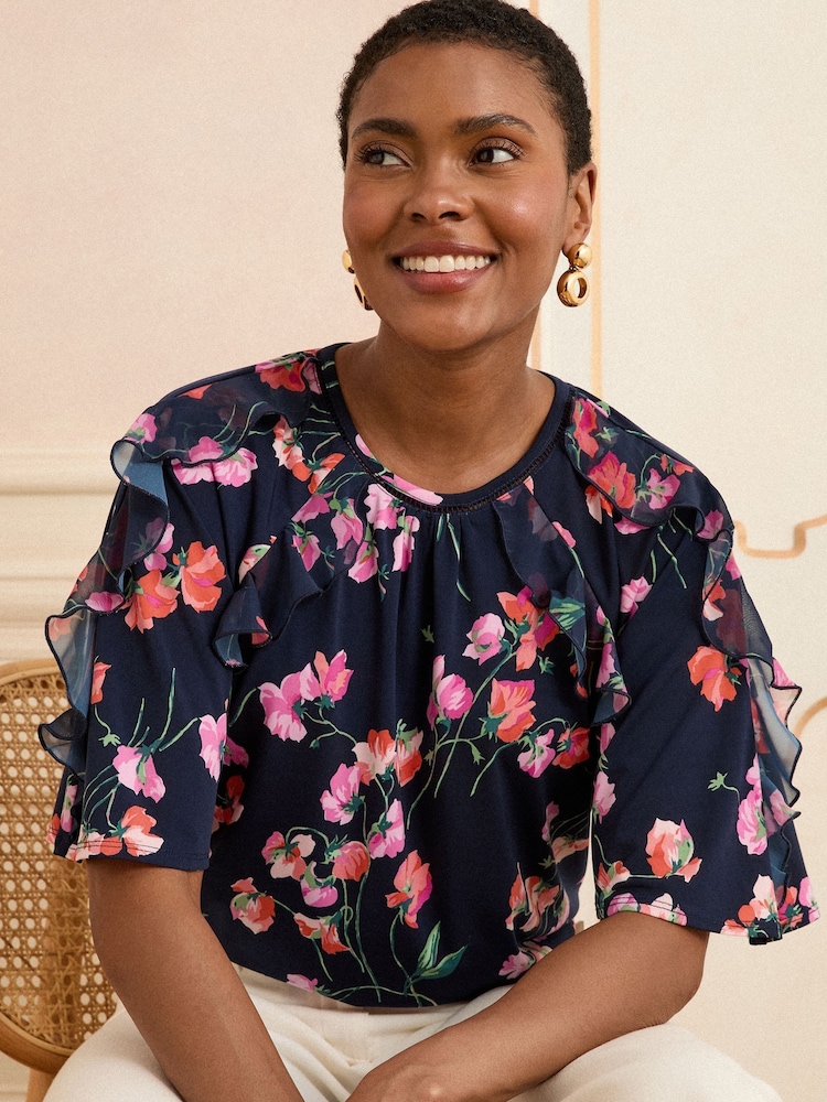 Love & Roses Blue/Navy Floral Print Short Sleeve Ruffle Blouse - Image 1 of 4 Love & Roses Blue/Navy Floral Print Short Sleeve Ruffle Blouse - Image 1 of 4