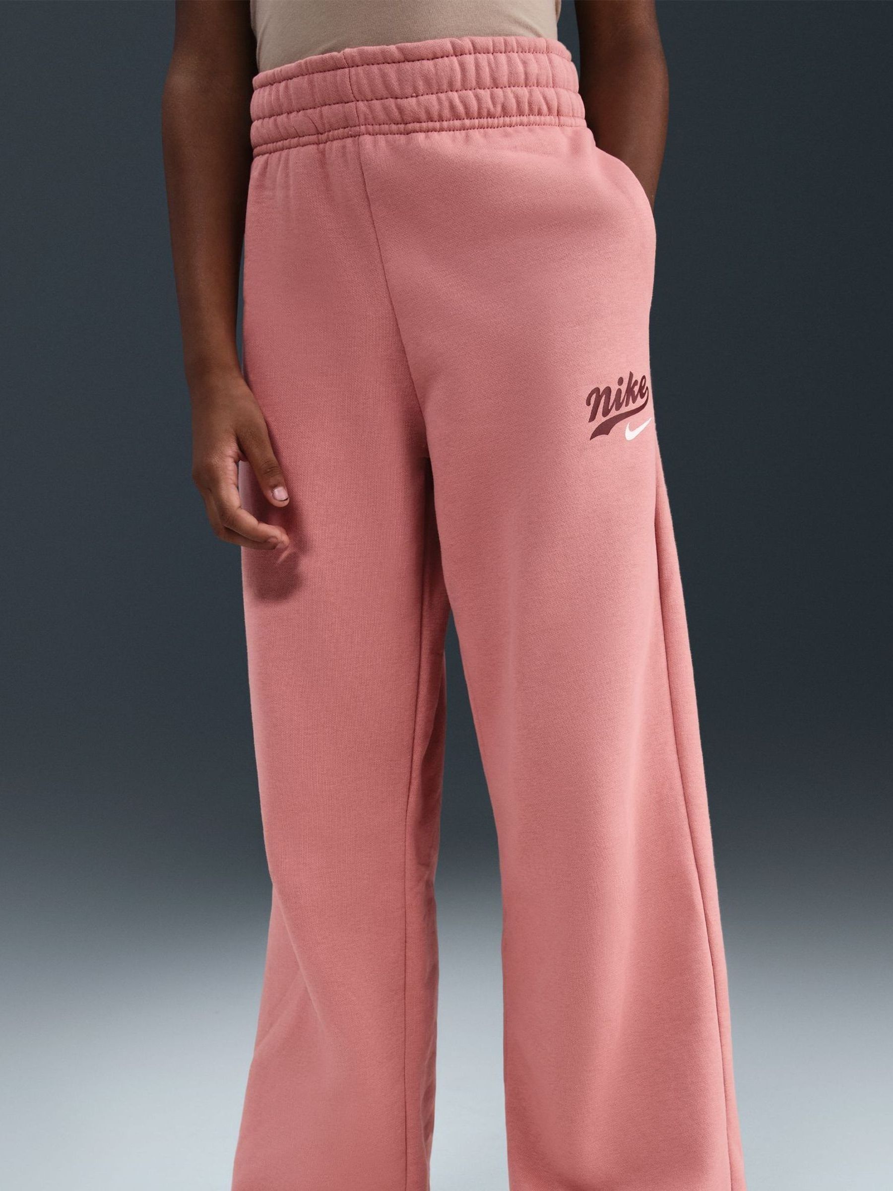 nike mini swoosh high waisted wide leg joggers in red