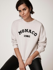 كريم - Mint Velvet Monaco Graphic Sweatshirt - صورة 1 من 8