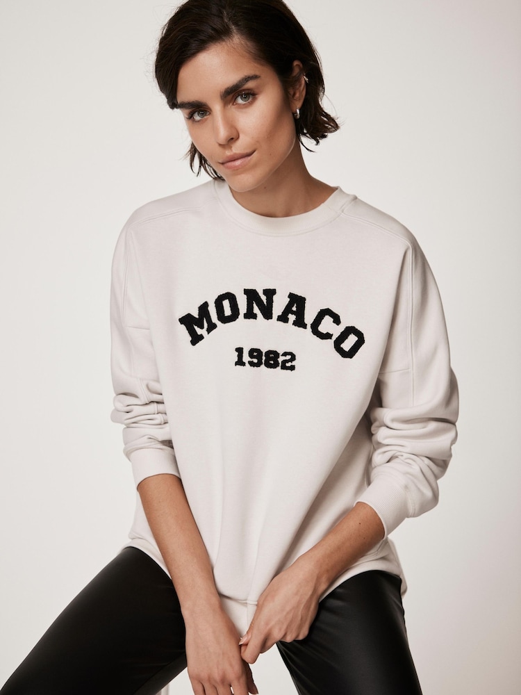 كريم - Mint Velvet Monaco Graphic Sweatshirt - صورة 1 من 8