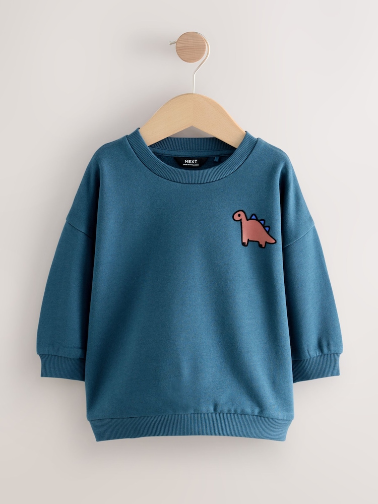Blue Dinosaur Back Printed Crew Neck Jersey Sweatshirt (3mths-7yrs) - Image 1 of 4 Blue Dinosaur Back Printed Crew Neck Jersey Sweatshirt (3mths-7yrs) - Image 1 of 4
