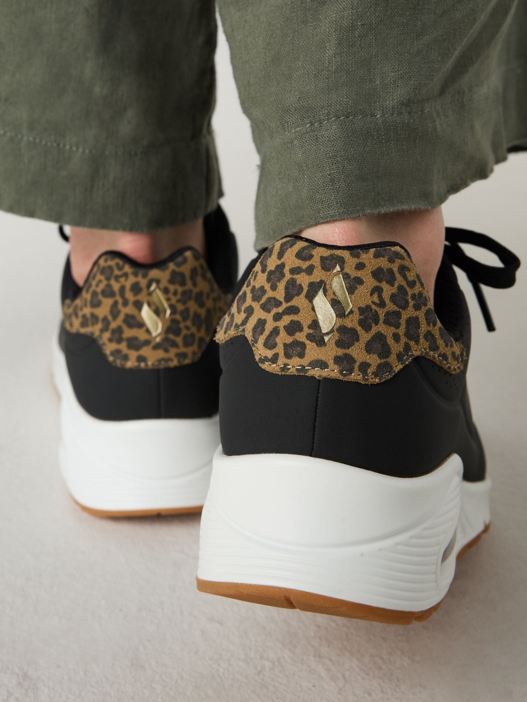 Buy Skechers Black UNO Jungle Nite Trainers from Next USA