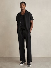 Reiss Black Rowden Textured-Knit Tapered Trousers - Image 1 of 6