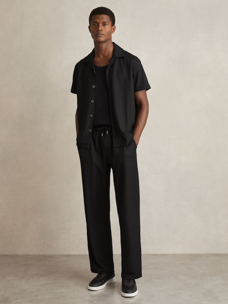 Reiss Black Rowden Textured-Knit Tapered Trousers - Image 1 of 6