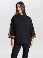 Gina Bacconi Dara Turtle Neck Black Jumper With Leopard Print Trim - Image 1 of 6